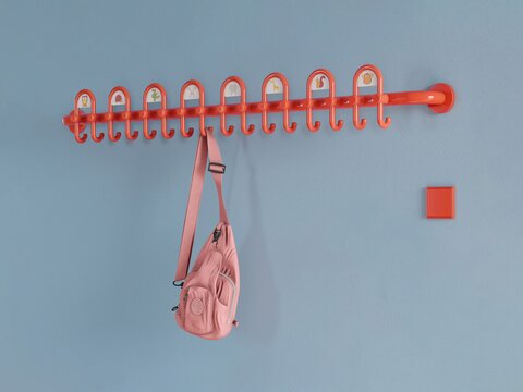 Kleurrijke kleuterschool uitgerust met inrichting en garderobe in de kleur oranje