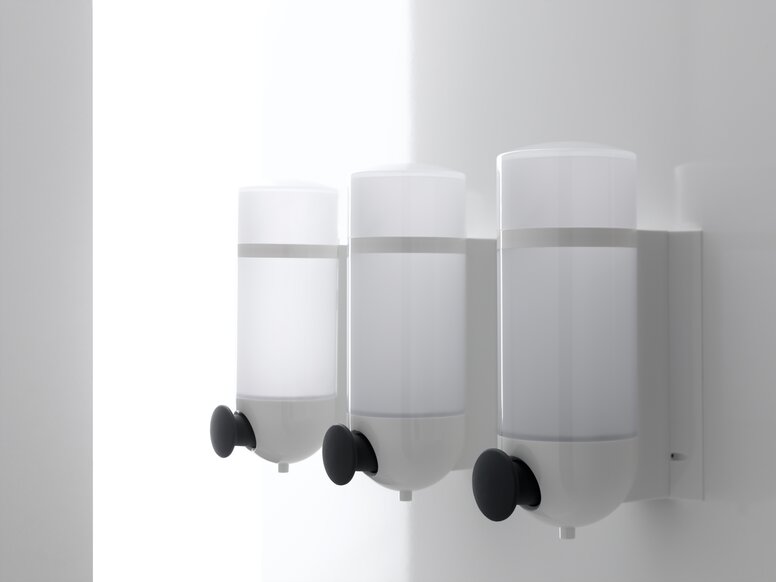 HEWI Zeepdispenser Wit Drie HEWI zeepdispensers met cilindrisch ontwerp in wit gemaakt van polyamide en drukknop in antraciet